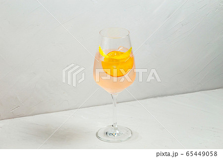 Cool refreshing cocktail with orange lemon zest Cool refreshing cocktail with orange lemon zest 65449058