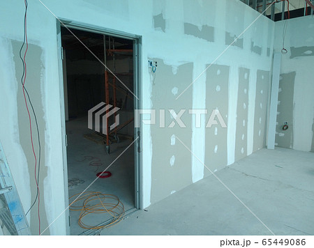 KUALA LUMPUR, MALAYSIA -APRIL 12, 2018: Drywall installation work in progress by construction workers at the construction site. It is the easiest and cheapest way to do partition for an interior wall. 65449086