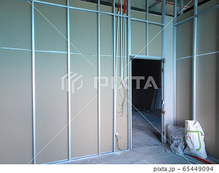 KUALA LUMPUR, MALAYSIA -APRIL 12, 2018: Drywall installation work in progress by construction workers at the construction site. It is the easiest and cheapest way to do partition for an interior wall. 65449094