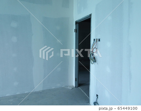 KUALA LUMPUR, MALAYSIA -APRIL 12, 2018: Drywall installation work in progress by construction workers at the construction site. It is the easiest and cheapest way to do partition for an interior wall. 65449100