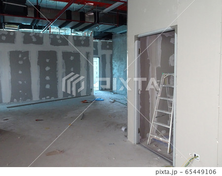 KUALA LUMPUR, MALAYSIA -APRIL 12, 2018: Drywall installation work in progress by construction workers at the construction site. It is the easiest and cheapest way to do partition for an interior wall. 65449106