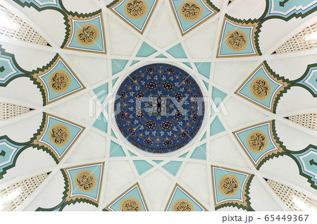 SARAWAK, MALAYSIA -OCTOBER 14, 2014: The interior of Sarawak State Mosque. The mosque has one big main prayer hall covered with one big and beautiful dome and supported with other small domes.  65449367