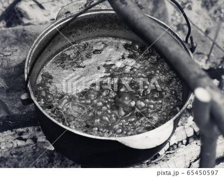 Ukrainian traditional soup cooking in old sooty 65450597