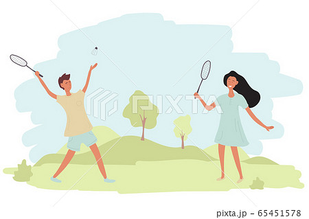 A couple a guy and a girl are playing badminton 65451578