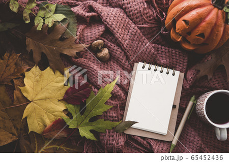 Notebook with pen and cup of tea 65452436