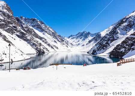 ski in chile on a sunny day with lots of snow. 65452810