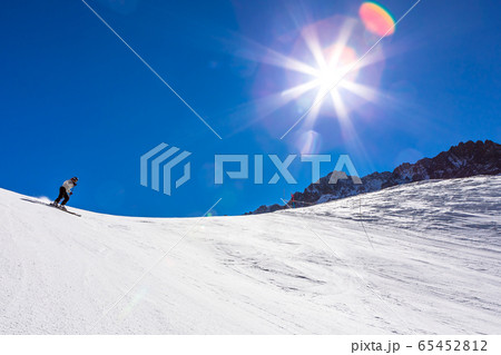 ski in chile on a sunny day with lots of snow. 65452812