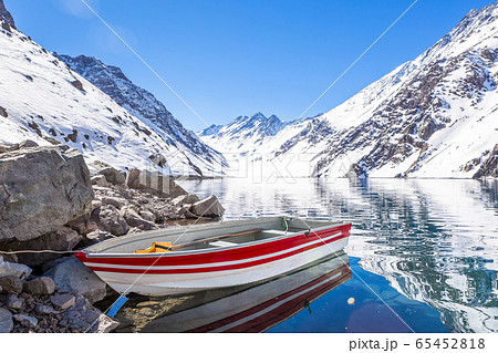 ski in chile on a sunny day with lots of snow. 65452818