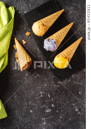 Top view of many bright yellow and violet ice Top view of many bright yellow and violet ice 65452911