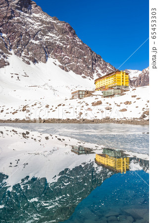 ski in chile on a sunny day with lots of snow. 65453303