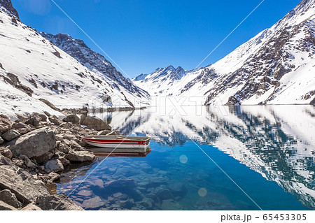 ski in chile on a sunny day with lots of snow. 65453305