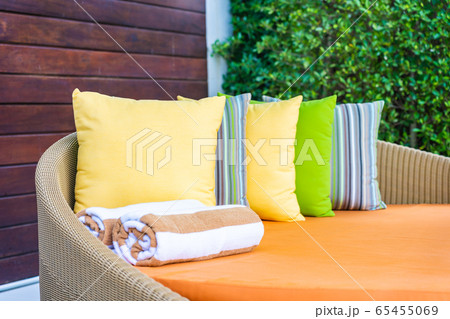 Umbrella and chair sofa around outdoor swimming pool in hotel resort for holiday vacation 65455069