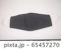 Black cloth mask for virus protection on white background .  65457270