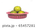 Many Thailand lemons arranged in a red basket isolate on white background . object for thai asian food advertising product 65457281