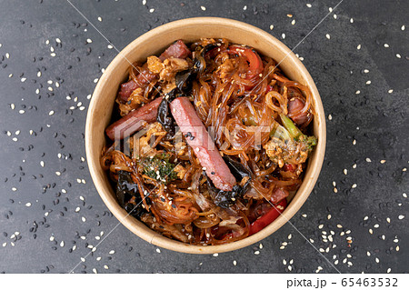 Stir fry noodle with chicken in a wok pan Stir fry noodle with chicken in a wok pan 65463532