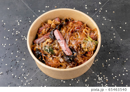 Stir fry noodle with chicken in a wok pan Stir fry noodle with chicken in a wok pan 65463540