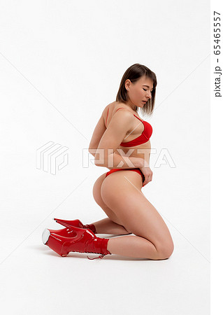 Beautiful woman sitting in underwear in studio - Stock Photo [41987574] -  PIXTA