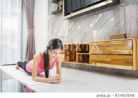 Asian girl relax by yoga in living room 65465698