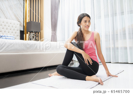 Asian girl relax by yoga in living room 65465700