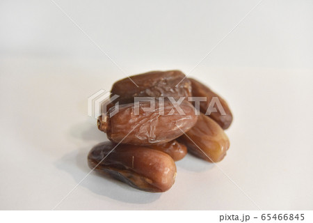 several dry dates on the white background several dry dates on the white background 65466845