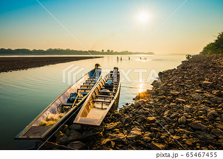 Fishing boat and sunrise in river 65467455
