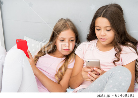 Mobile addicted. Girl play games smartphone Mobile addicted. Girl play games smartphone 65469393