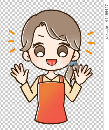Woman in an apron smiles with both hands raised 65469447