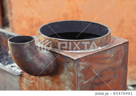 Part of metal barbecue brazier with pipe Part of metal barbecue brazier with pipe 65470491