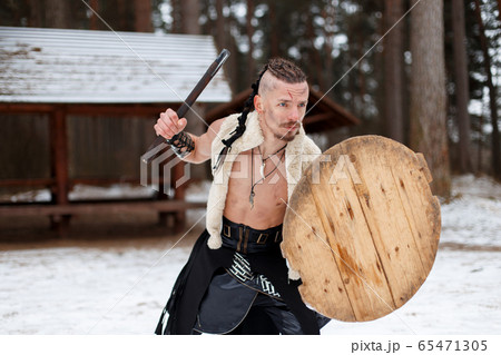 Ancient Warrior man viking with an ax and shield Ancient Warrior man viking with an ax and shield 65471305
