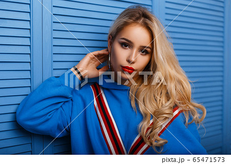 Fashionable woman with red lips in trendy clothes Fashionable woman with red lips in trendy clothes 65471573