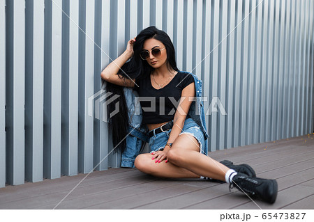 Young hipster woman in sunglasses Young hipster woman in sunglasses 65473827