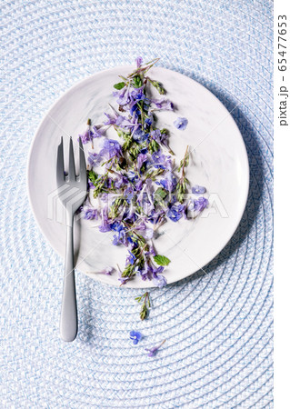 Edible flowers on plate Edible flowers on plate 65477653