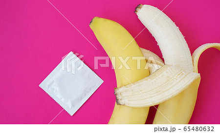 Condoms and two bananas together, concept of contraceptives and the prevention Condoms and two bananas together, concept of contraceptives and the prevention 65480632