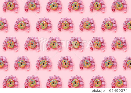 Donat pattern on pink background. Abstract funny Donat pattern on pink background. Abstract funny 65490074