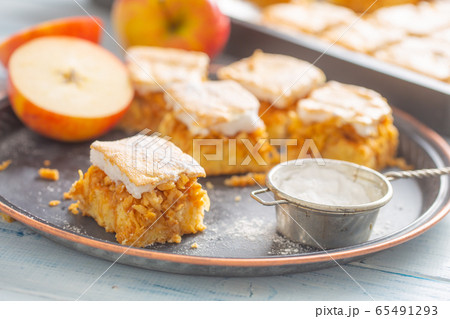 Five cubes of apple plie with a cream topping Five cubes of apple plie with a cream topping 65491293