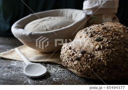 Seed bread, sourdough loaf raw in proofing basket, Rye flour. Home made, organic food. Fresh bakery. 65494377