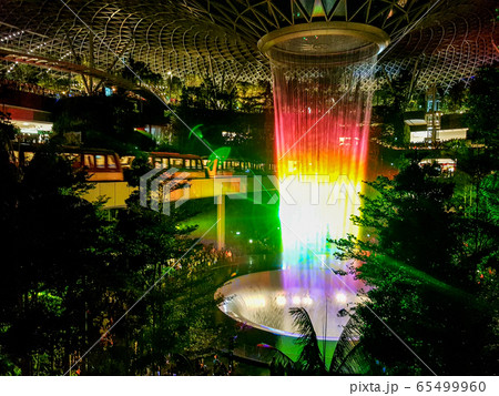 Lighting show over the man-made waterfall at Jewel Department store in Changi Airport, Singapore Lighting show over the man-made waterfall at Jewel Department store in Changi Airport, Singapore 65499960