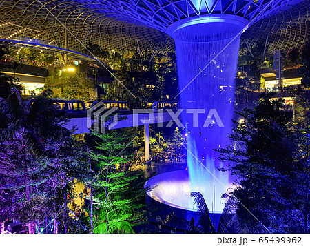 Lighting show over the man-made waterfall at Jewel Department store in Changi Airport, Singapore Lighting show over the man-made waterfall at Jewel Department store in Changi Airport, Singapore 65499962