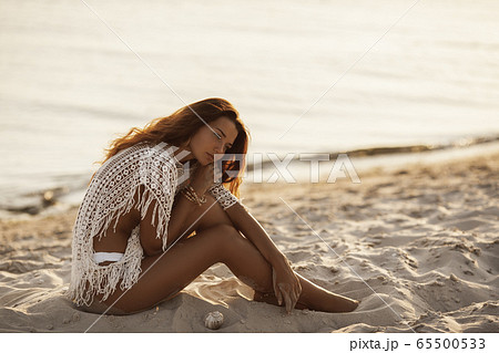 Woman Resting on the Beach During Vacations 65500533