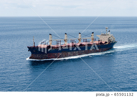 An old bulk carrier or bulker sails in the sea to trade around the world 65501132