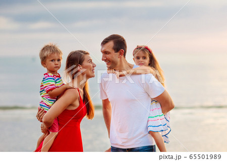 Family with kids on tropical beach. Sea vacation. Family with kids on tropical beach. Sea vacation. 65501989