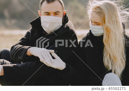 People in a masks walks in a spring forest People in a masks walks in a spring forest 65502271