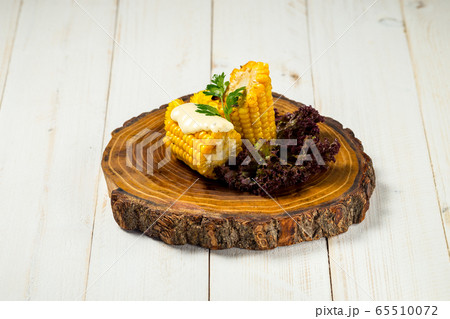 Appetizing delicious cooked cut corn with butter 65510072
