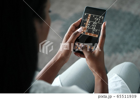 Black Woman Playing Sudoku On Phone For Brain Training Black Woman Playing Sudoku On Phone For Brain Training 65511939