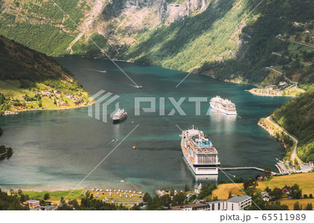 Geirangerfjord, Norway. Aerial View Of Geiranger In Geirangerfjorden In Summer Day. Touristic Ship Ferry Boat Liner Moored Near Geiranger. Famous Norwegian Landmark And Popular Destination 65511989