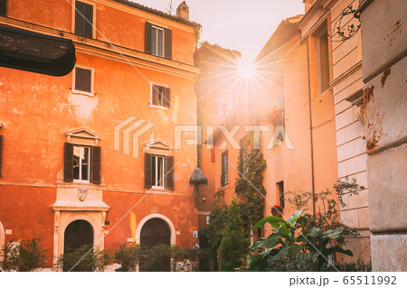 Rome, Italy. Sunshine Sun Shine Above Roofs Old Houses Rome, Italy. Sunshine Sun Shine Above Roofs Old Houses 65511992
