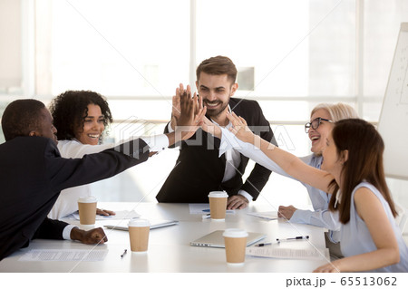 Happy motivated diverse business team people giving high five Happy motivated diverse business team people giving high five 65513062