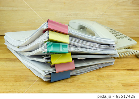 file folder and Stack of business report paper file on the table in a work office, concept document in work office file folder and Stack of business report paper file on the table in a work office, concept document in work office 65517428