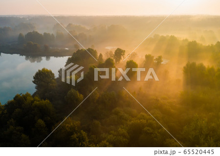 Beautiful misty dawn in the spring on the river. Beautiful misty dawn in the spring on the river. 65520445