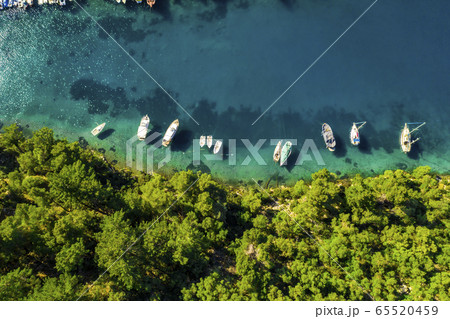 Yachts in the bay near the green island. Summer vacation, Greece, Kefalonia. 65520459